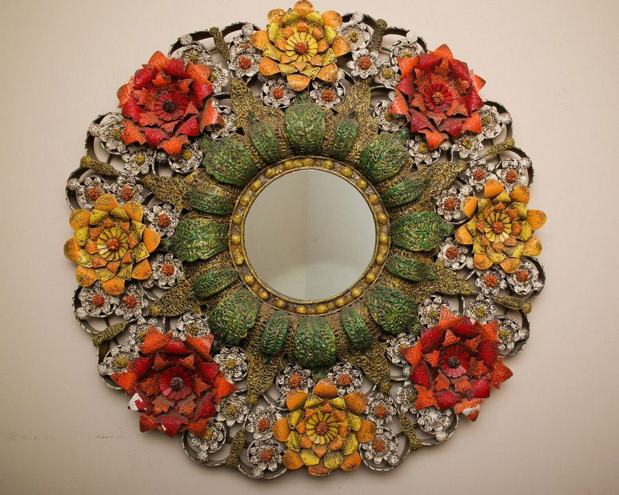 Vintage Mexican Tole Folk Mirror by Saldana: Large 40" in diameter colorful Mexican tole flower mirror by Saldana of Mexico. Some minor pait loss to a few of the leaves.