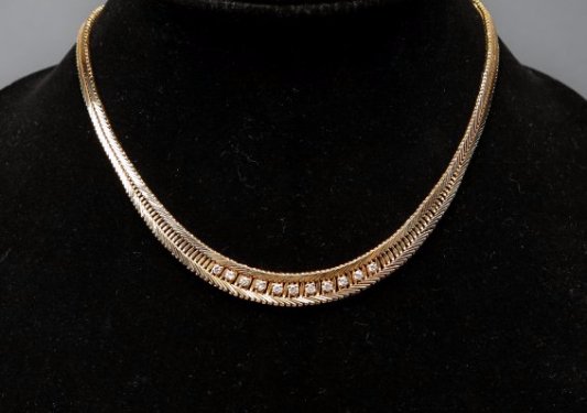 14K Yellow Gold and Diamond Necklace: Beautiful 14k yellow gold and diamond necklace. 11 diamonds set in an interesting herringbone style chain with a locking safety clasp. Diamonds = approx 3/4cttw. Diamond clarity = SI1. Clearly marked