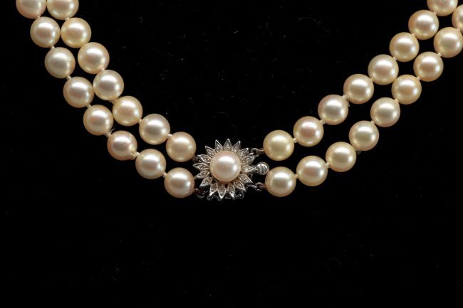 Double Strand Of Creamy Saltwater Pearls Diamonds: Beautiful double strand of 8mm creamy white pearls with beautiful lustre held in place with a 14k white gold and diamond flower shaped safety clasp. There are a total of 134 8mm round pearls with knot