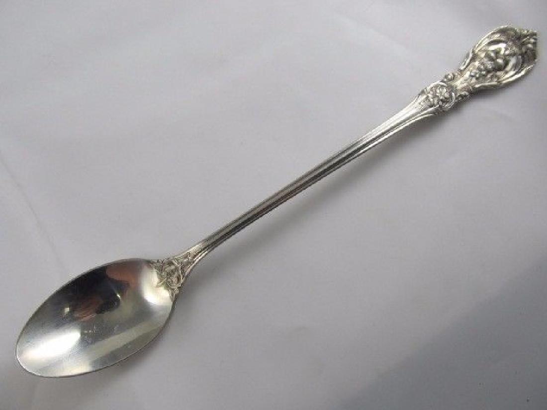REED & BARTON FRANCIS I STERLING SILVER ICED TEA SPOON: It is in excellent condition with very slight signs of being used including mild scratches. It is about 7 5/8 inches long. It weighs over 1.1 troy ounces. It has an older patina or can be easily polis