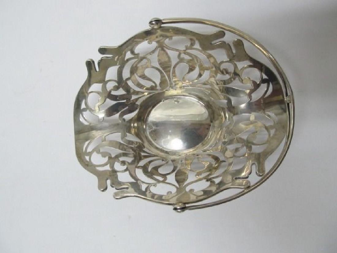 FRANK SMITH ART NOUVEAU FLEUR DE LIS STERLING BASKET: This is a very fine quality art nouveau Frank Smith Fleur de Lis sterling silver movable handled basket. It is about 6 1/4" H (handle up)X 6 1/2" W X 4 3/4" across. It has a great finish & was polishe