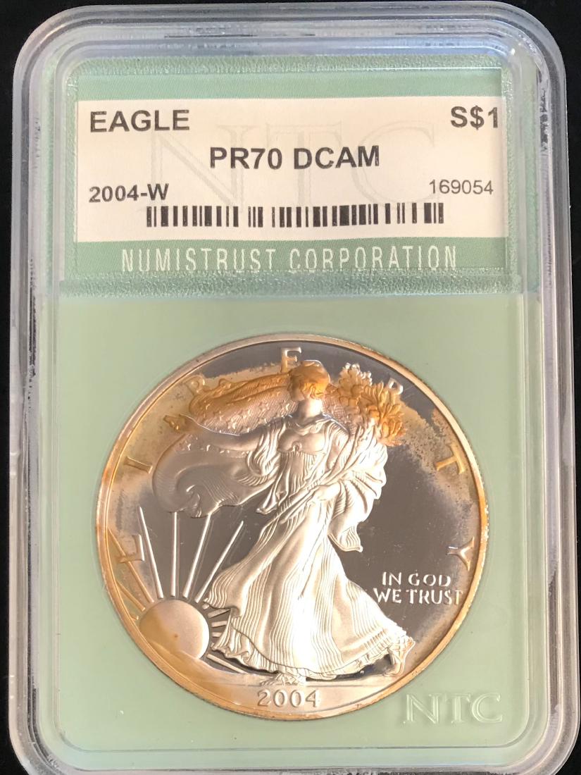 2004-W $1 American Silver Eagle NTC PR70 DCAM ``` (1 of 2)