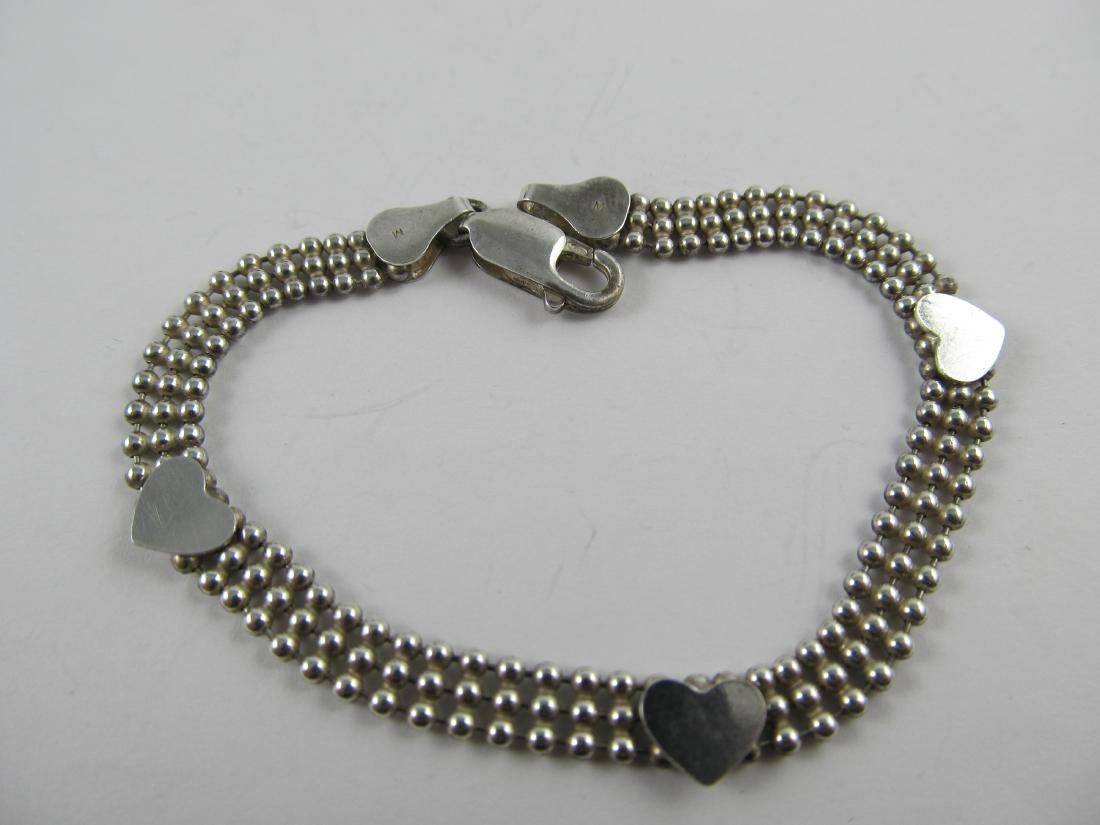 ITALY \'M\' STERLING SILVER VINTAGE BRACELET W/ HEARTS: This is a very wearable sterling bracelet stamped M Italy 925 with hearts. It is in overall very good condition with only very slight wear. The lobster lock closes nicely. It has an older patina & wil