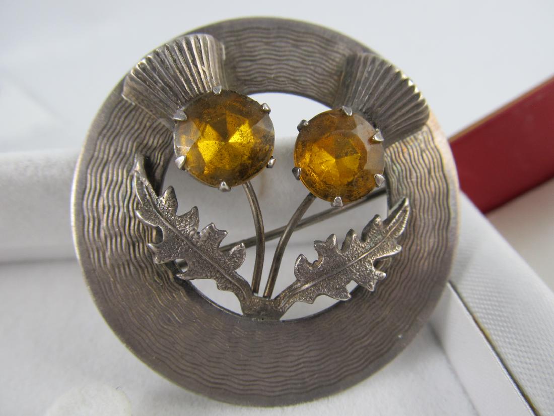 This finely-made, heavy sterling pendant features 10: This is a fine stamped sterling pin featuring Scottish thistles. It has 2 nicely mounted synthetic stones. It is in overall excellent condition & is ready to wear. It has a fine patina & shoul