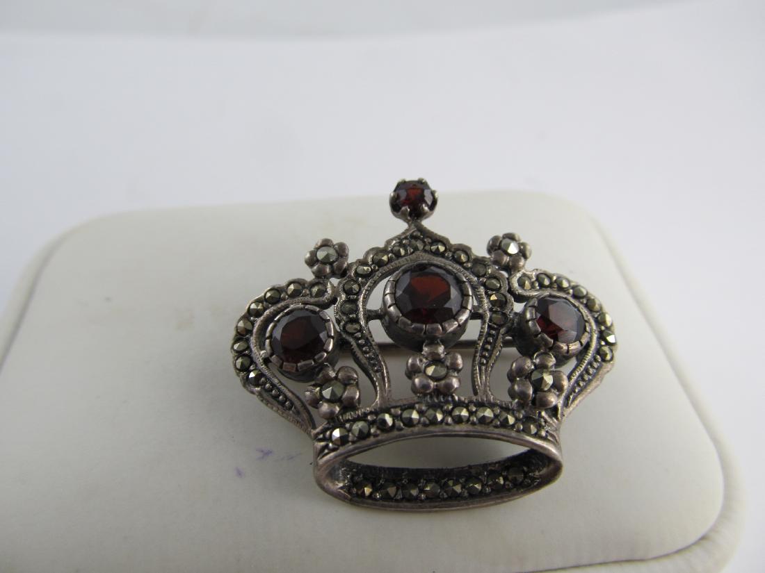 LS LOUIS STERN CROWN PIN 4 GARNETS / MARCASITES: This is very well-made sterling pin features 4 garnets in a crown by LS with finely inset marcasites. There is an obscured 925 mark, but the pin also tests sterling. It is in overall very good conditi