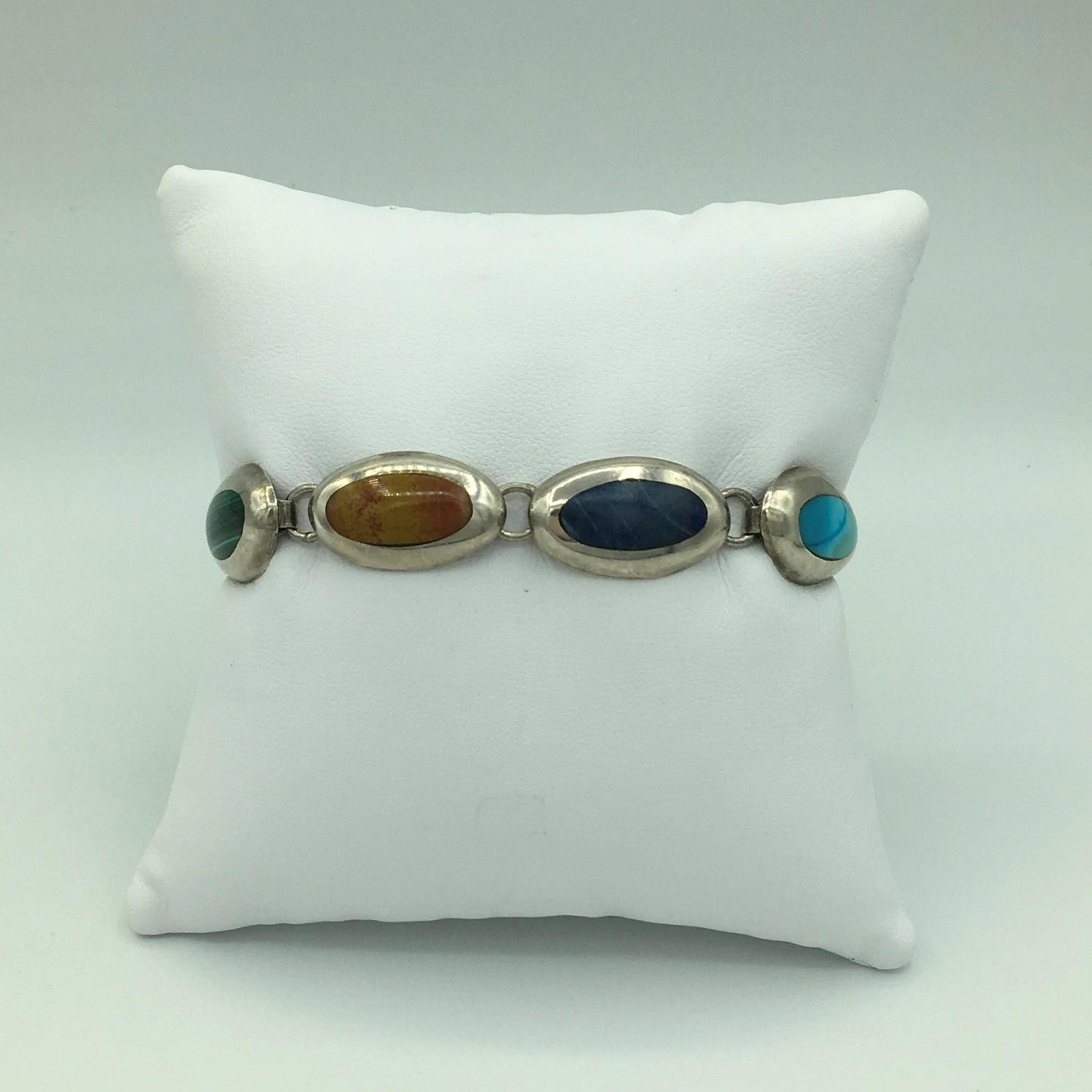 Sterling Silver and Multi Colored Gemstone Bracelet 27: Sterling Silver and Multi Colored Gemstone Bracelet 27 Grams. 17.4 dwt. Marked L\\\'T-26 Mexico 925 See Photo. Bracelet Measures 7 Inches or 188 mm and is in Very Nice Condition.