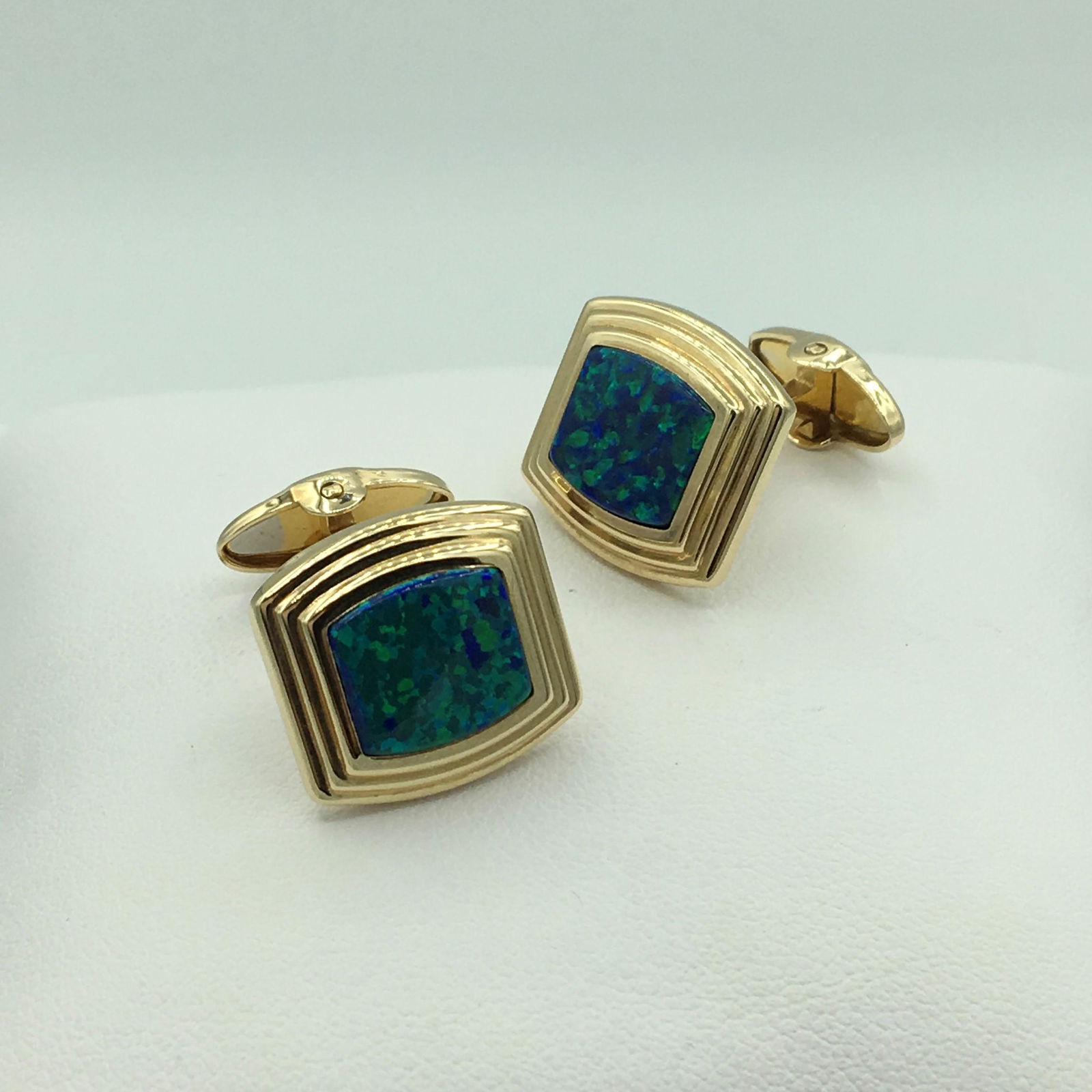 14K Yellow Gold and Australian Opal Cuff Links 9.0: 14K Yellow Gold and Australian Opal Cuff Links 9.0 Grams 5.8 Dwt. Marked 14K DB See Photo. Each Cuff Link Measures 5/8 x 5/8 Inches or 17 x 17 mm. These Handsome Cuff Links will Add A Real Accent of C