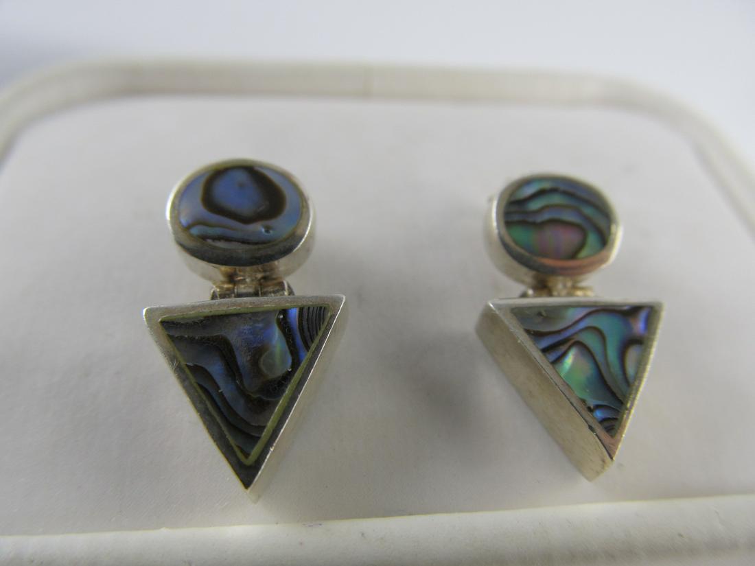 ABALONE SHELL INSET STERLING SILVER POSTED EARRINGS 7/8: This very well-made sterling pair of earrings with abalone shells is in overall very good condition excluding some light scratching. The pair has an older patina & should polish nicely using silver po