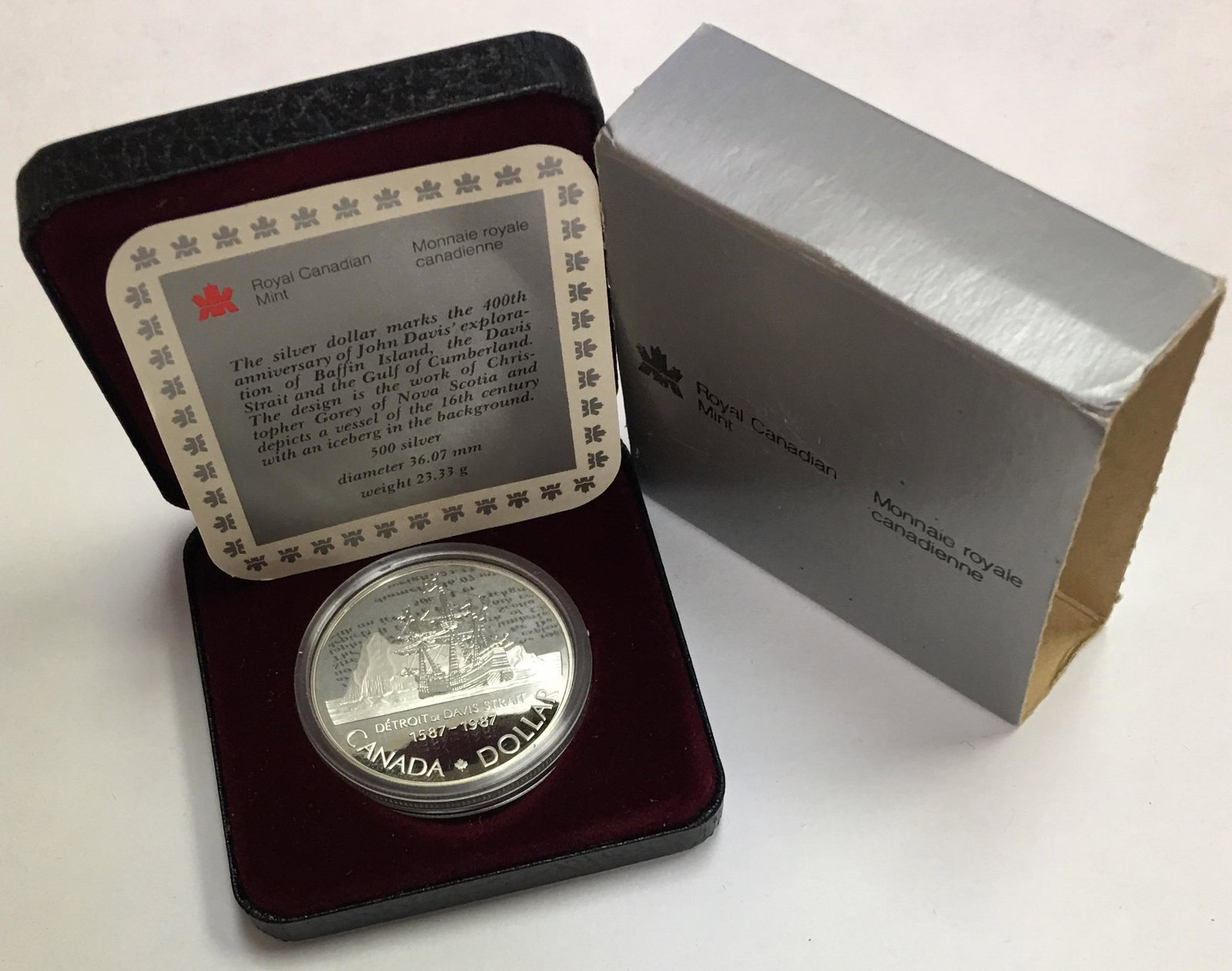 1987 Canada Silver Dollar, 400th Anniversary of John: 1987 Canada Silver Dollar, 400th Anniversary of John Davis\' Exploration in Original Box. This $1 silver coin is 0.500 silver 0.375 oz. ASW with a weight of 23.33 grams and a diameter of 36 mm.