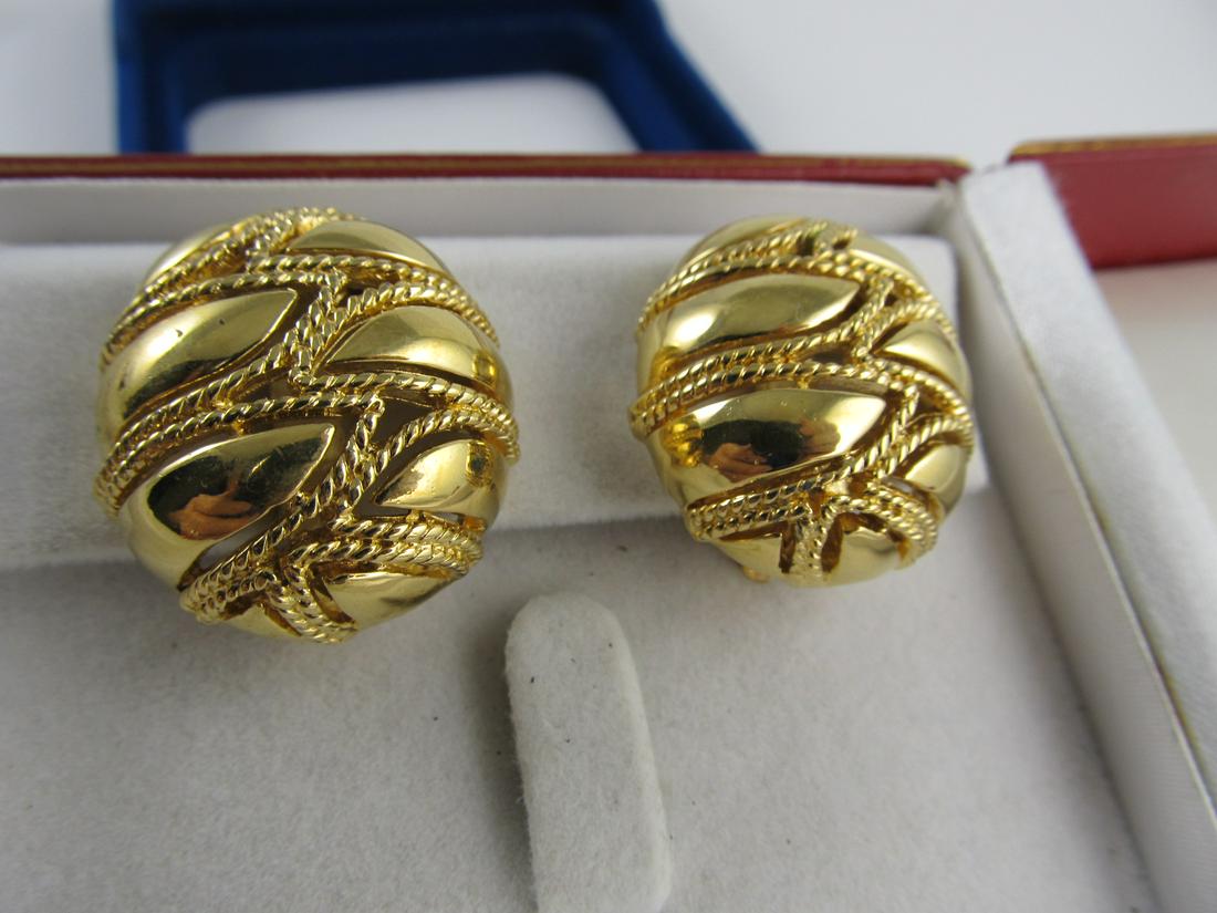 CINER GOLD TONE ATTRACTIVE OVAL CLIP ON EARRINGS 1 1/8": This choice Ciner pair of slightly oval, gold tone, clip-back earrings is in overall excellent condition with no apparent wear. The clip backs close nicely; one of the plastic grips is missing. The pa