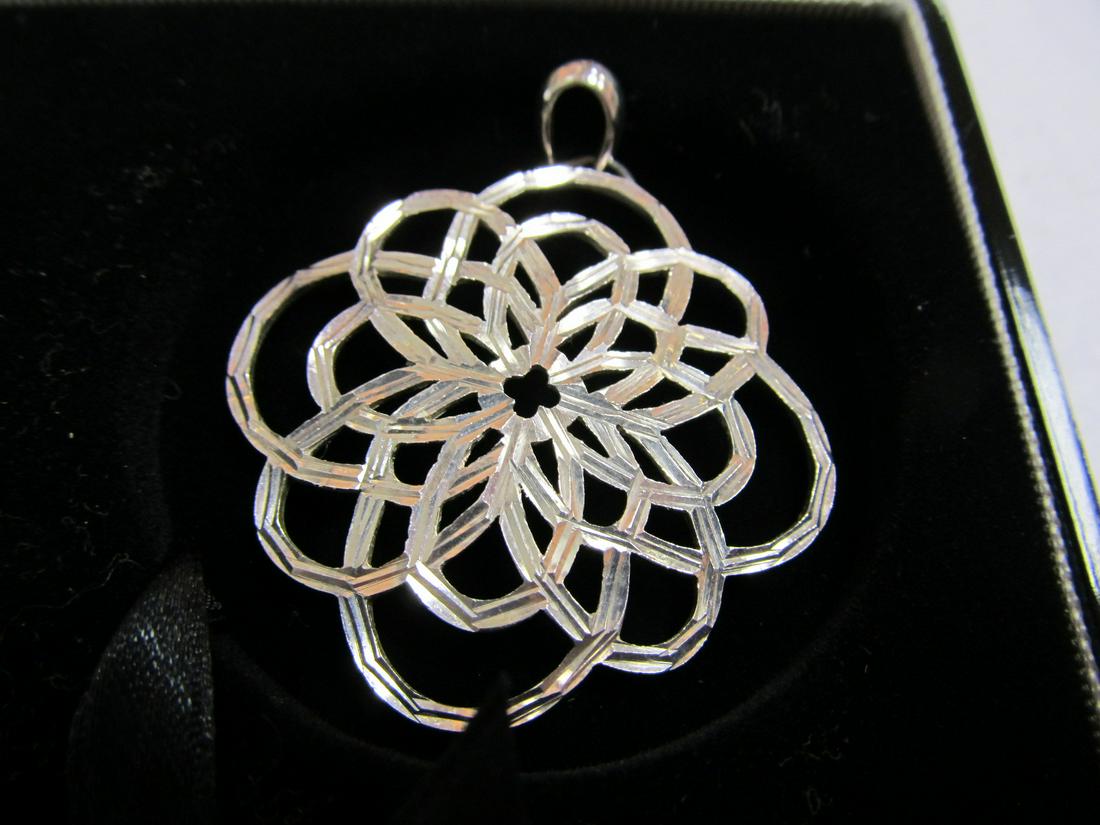 JC ATTRACTIVE PENDANT HAND CUT ACCENTS STERLING SILVER: This is a very attractive .925 intricate sterling pendant featuring nicely-cut accents on the top surface. It is in overall excellent condition with no wear seen. The top loop is stamped JC? 925 & the