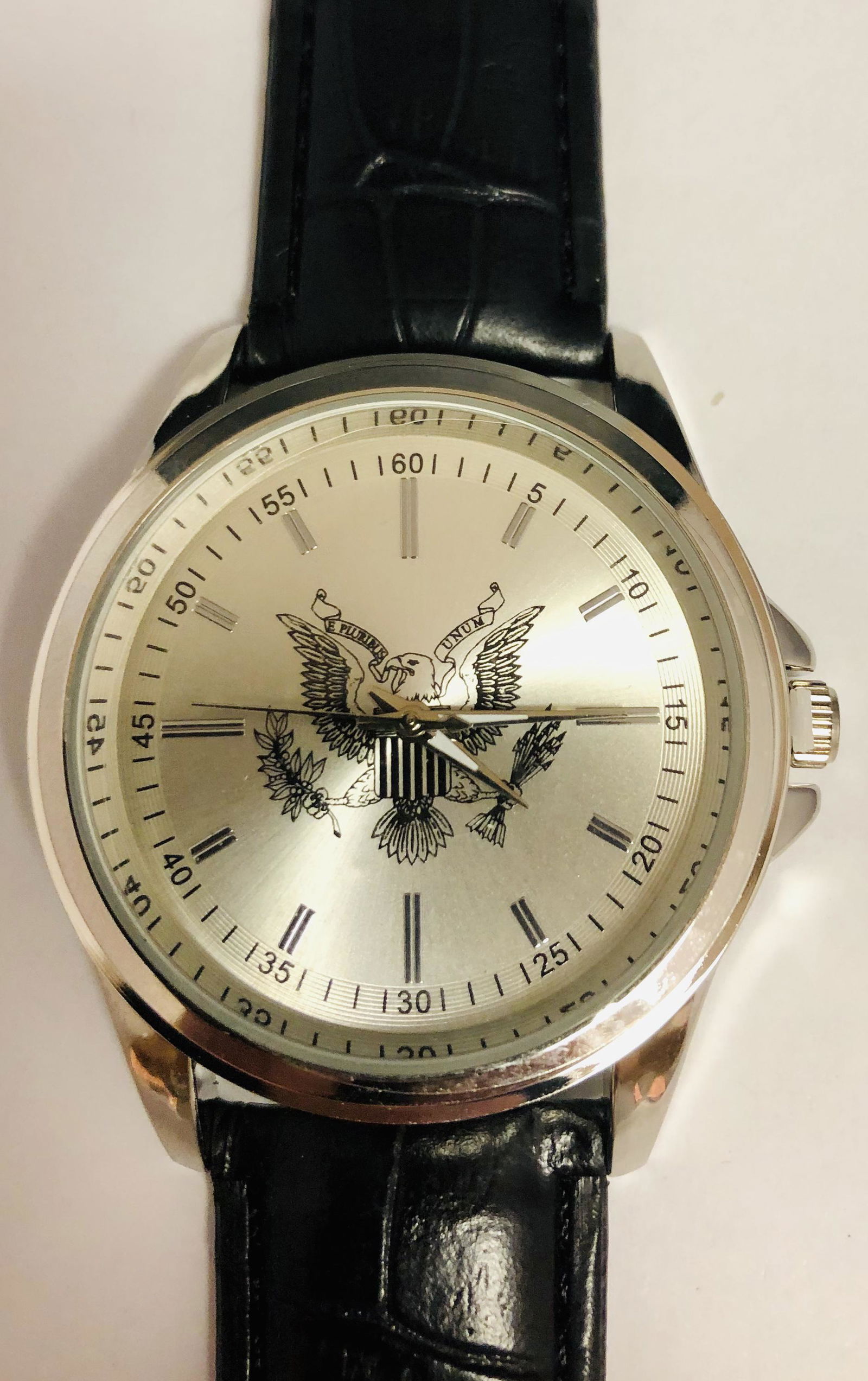 Mens 42 mm Eiger American Eagle Quartz Wrist Watch: Mens 42 mm Eiger american eagle quartz wrist watch with a Black faux leather band and a new battery.