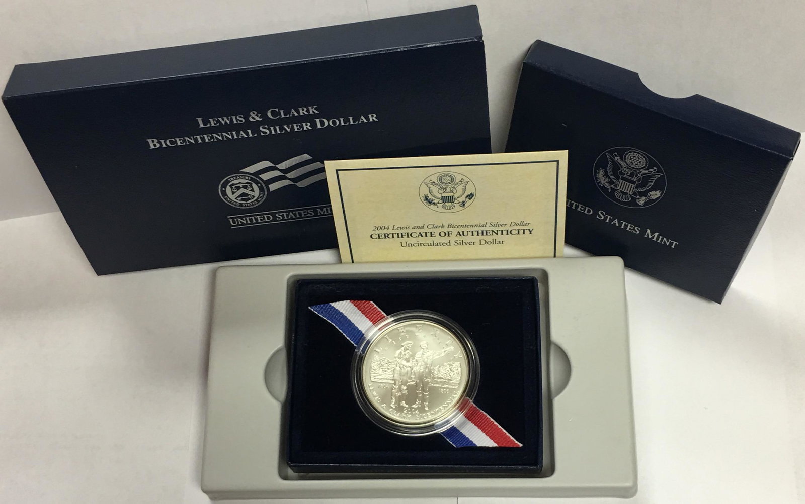 2004-P $1 Lewis & Clark Bicentennial Commemorative: 2004-P $1 Lewis & Clark Bicentennial Commemorative Silver Dollar in US Mint Original Government Packaging BU