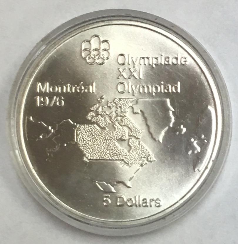 1973 Canada Commemorative Montreal 1976 Olympics Silver: 1973 Canada Commemorative Montreal 1976 Olympics Silver Five Dollars - North American Map KM# 85. This $5 silver coin is 0.925 silver with a weight of 24.30 grams and a diameter of 38 mm.