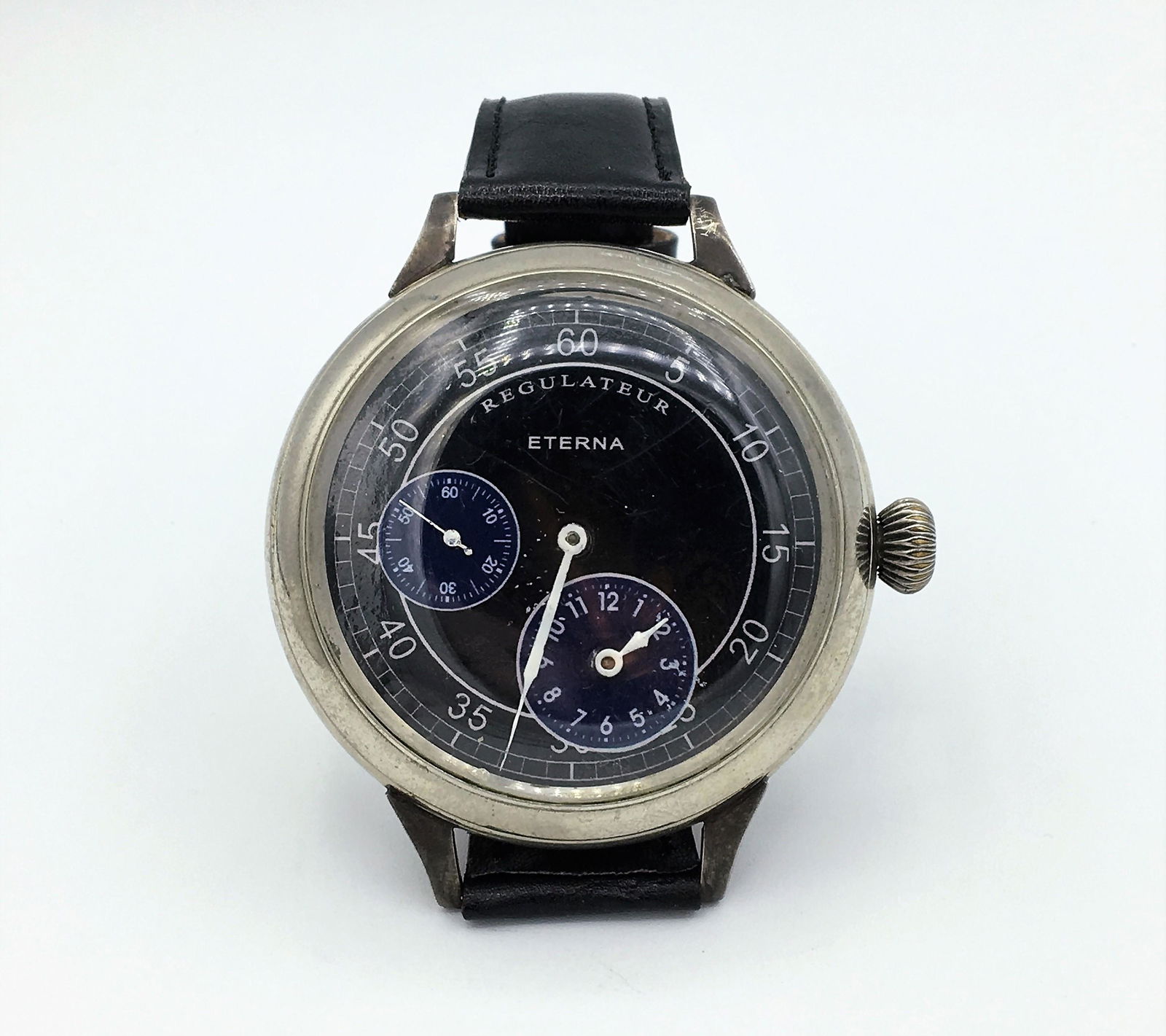 Vintage Eterna Regulateur Mens Wrist Watch Serial: Vintage Eterna Regulateur Mens Wrist Watch Serial Number 1676227 Size 22 Runs. Measures 60 mm Diameter, Total Length 10 Inches. Cow Skin Band Size 22. Running Working Condition May Need Overhaul.