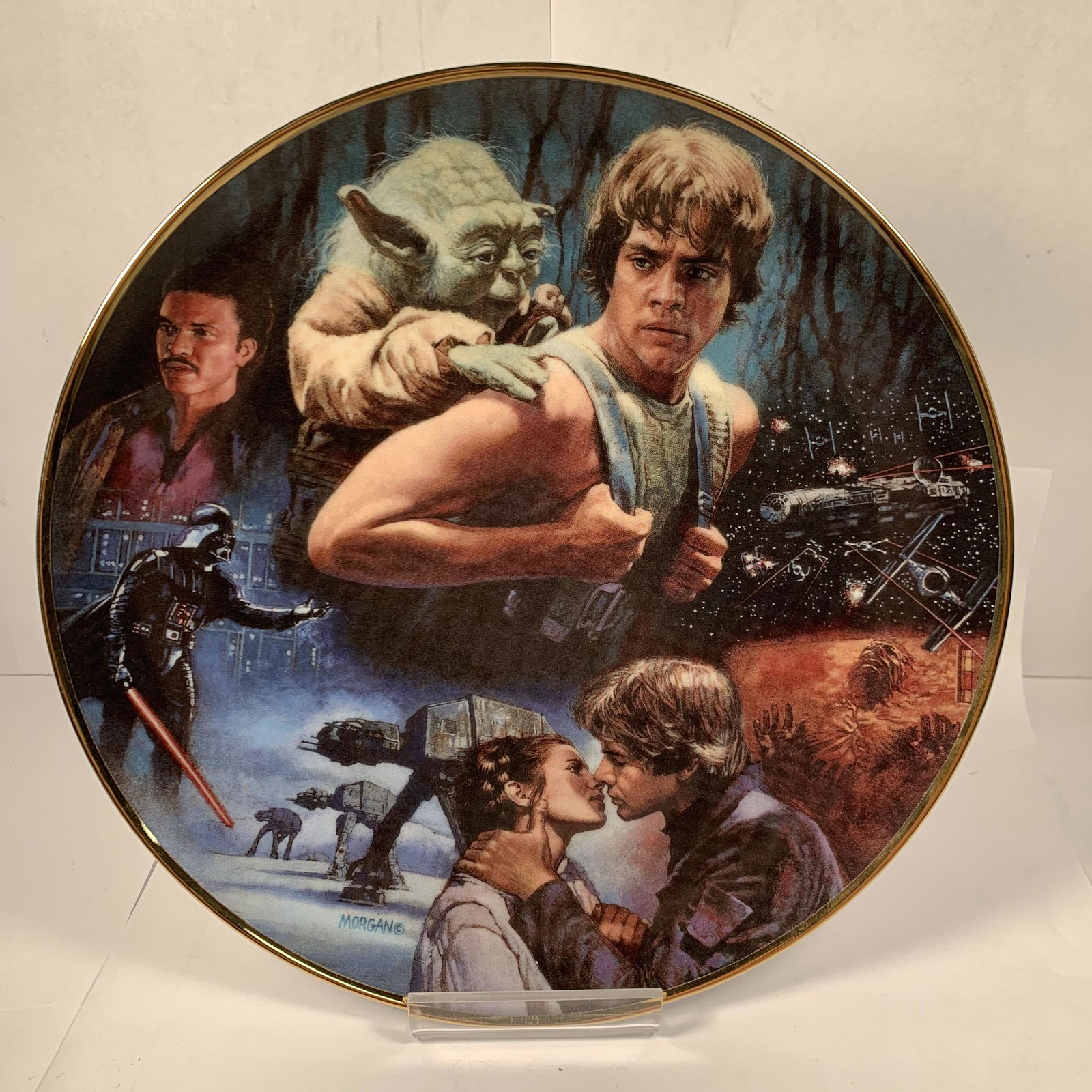 The Hamilton Collection Star Wars Plate The Empire: This nice Hamilton Collection Star Wars Plate The Empire Strikes back is in excellent condition with no flaws seen. It is # 0617 B. It is about 9 1/2" wide. There is no box.