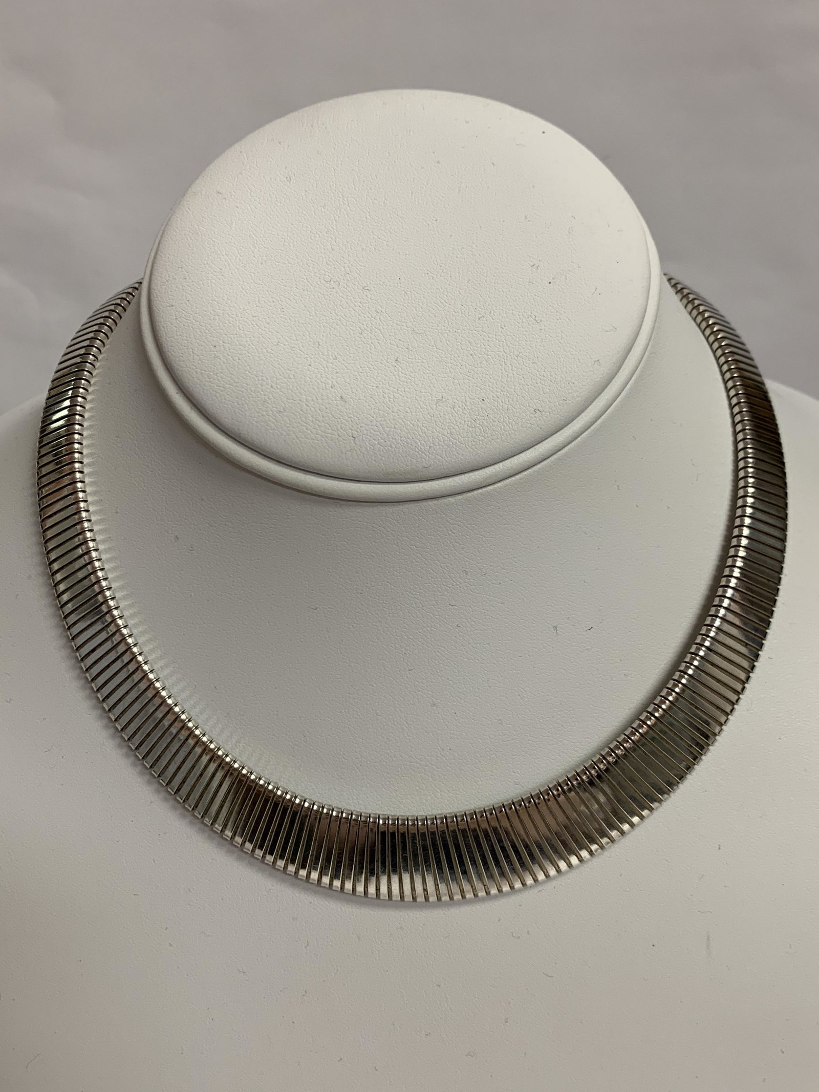 Sterling Choker Necklace 5/8" Widest Center 3/8" Top 14: This beautiful sterling silver choker necklace is in overall excellent condition. It has had a quick polish & is ready to wear. It measures about 5/8" wide at the bottom center & about 3/8" wide at th