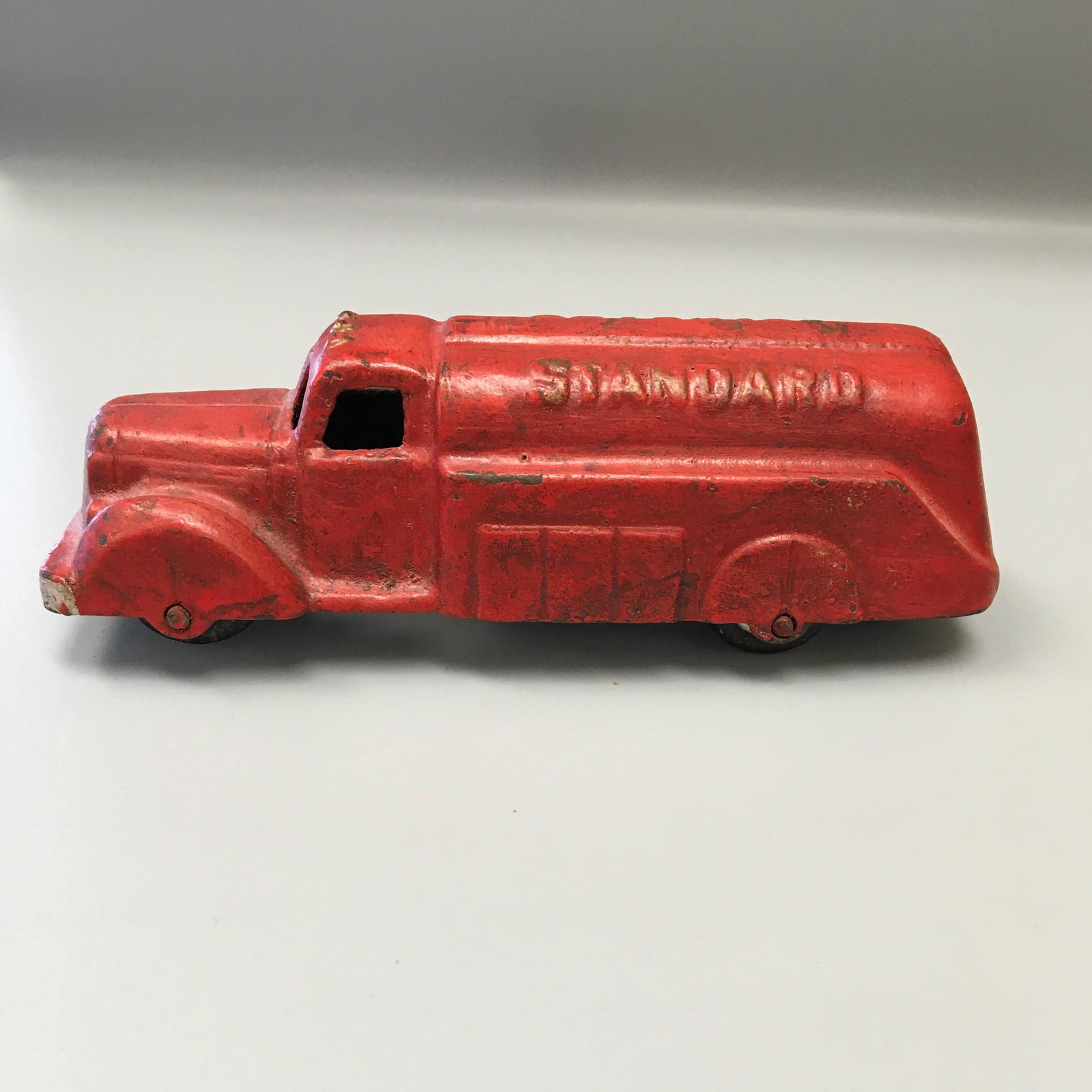 Vintage Cast Iron Standard Oil Truck Toy: Vintage Cast Iron Standard Oil Tank Truck Toy, Marked Standard, 6 in. long.