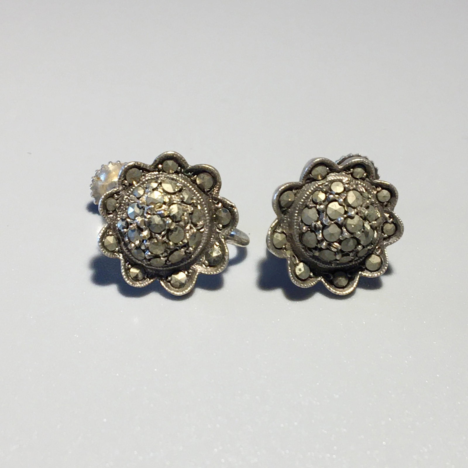 Silver & Marcasite Screw Back Sunflower Earrings: Silver & Marcasite Screw Back Sunflower Earrings, Marked .835, Measure 1/2 in. Each, 2.8 dwt.