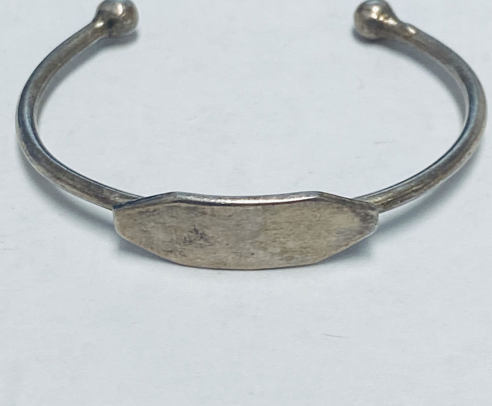 STERLING BABY CHRISTENING BRACELET EXCELLENT CONDITION NO MONO: This nice baby bracelet is in overall excellent condition. There is a little very minor scratching. It has an older patina and will benefit from a quick polish.It is about 1 3/4 inches wide.It weighs