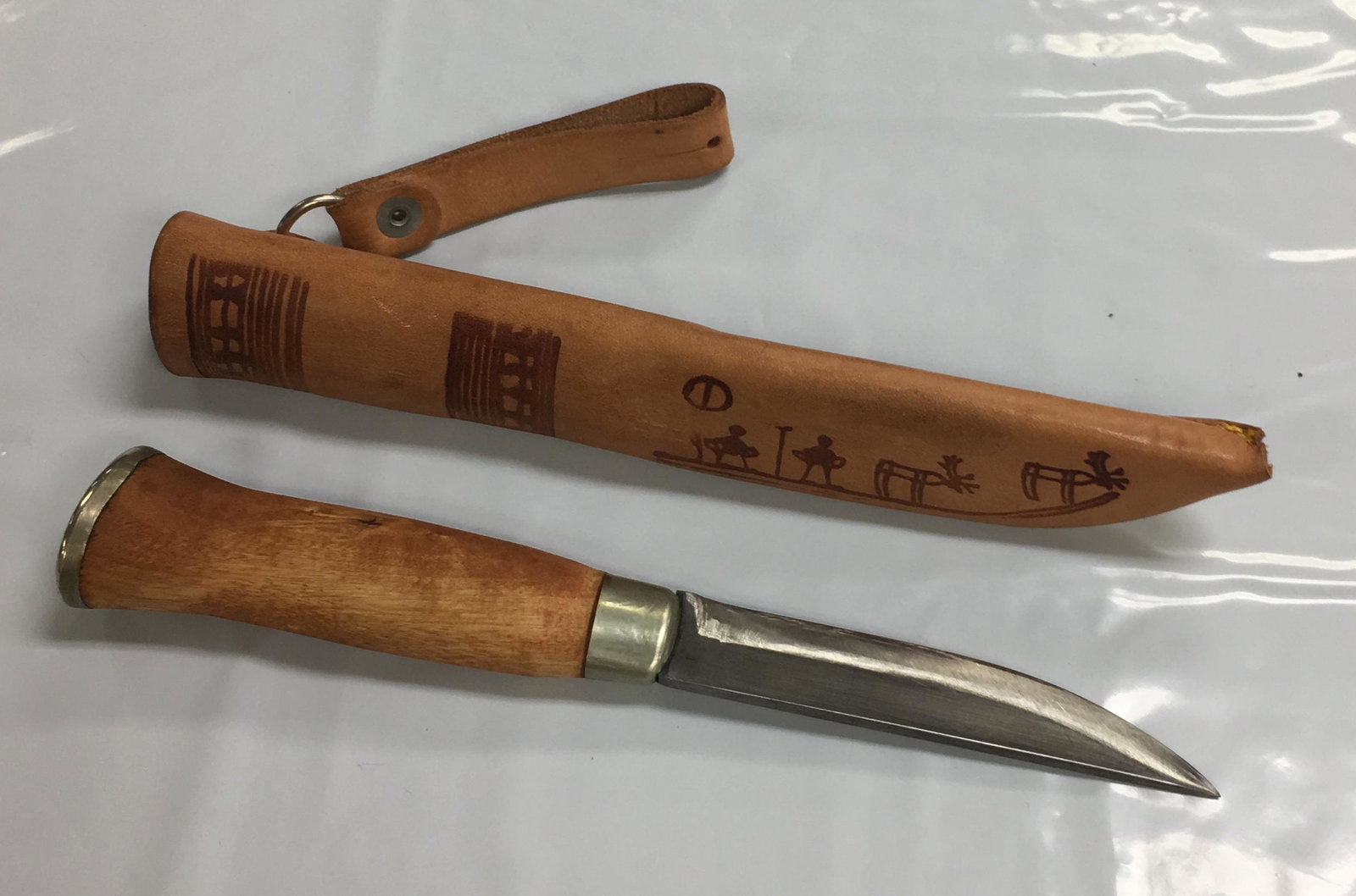 J. Marttiini Finland Wooden Handle Fixed Blade Hunting Knife with Sheath: This knife is in very good condition with signs of wear like light scratches on the blade as shown in the photos. It comes with leather sheath which is in excellent condition. The knife measures about
