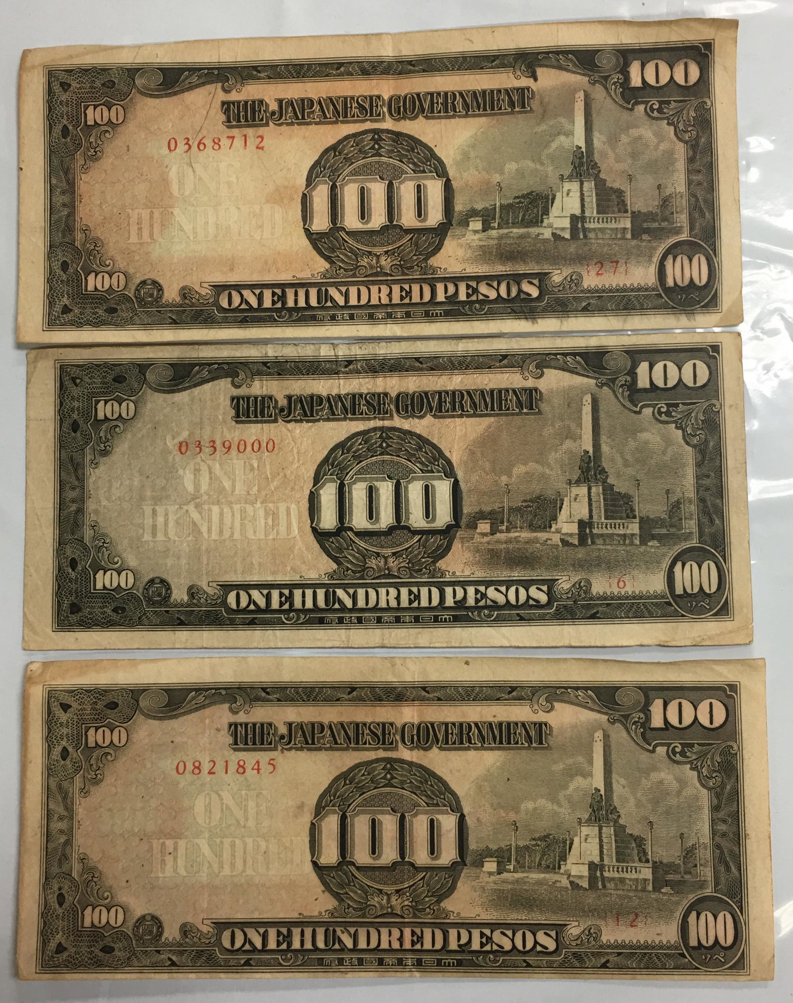 Lot of 3 WWII The Japanese Government One Hundred Pesos Banknotes: These banknotes are circulated and uncertified. Please, review pictures for condition and details.
