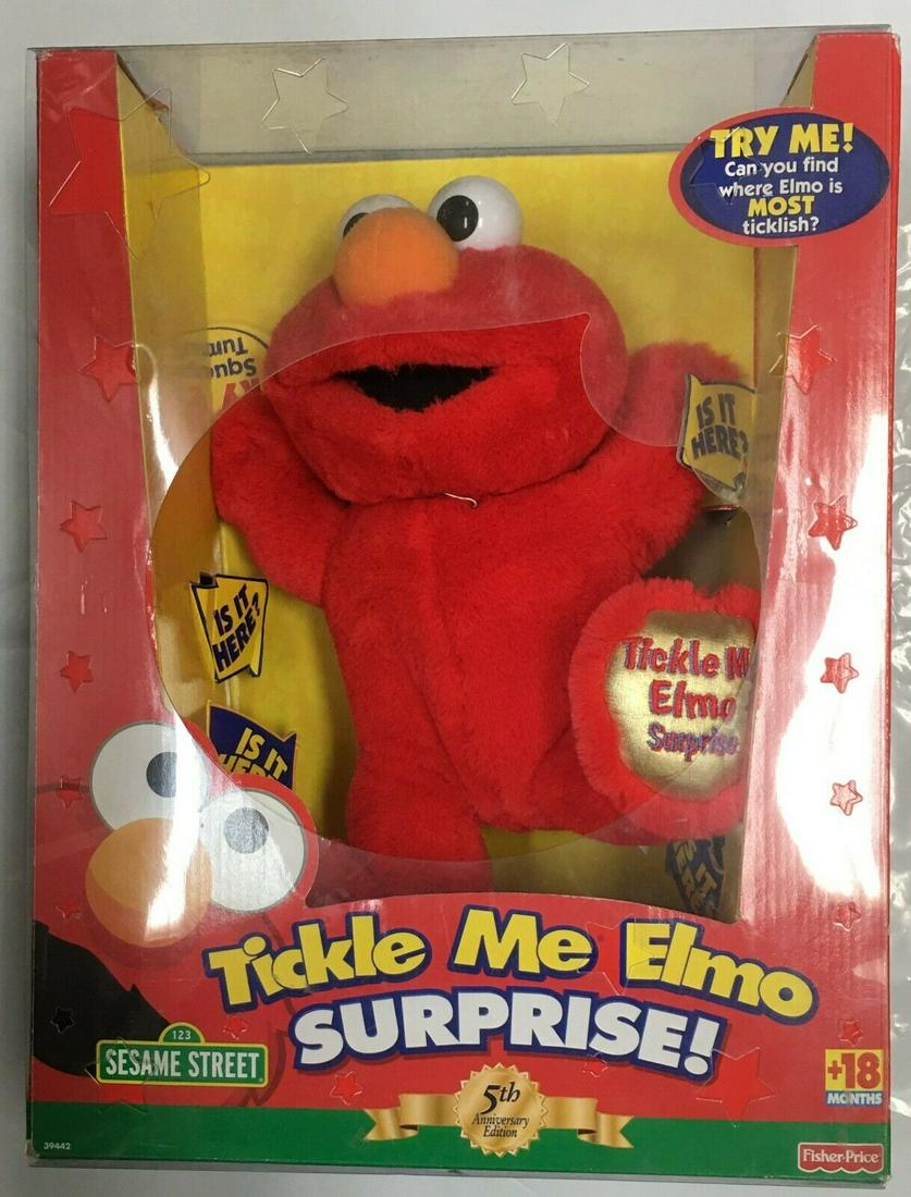 Fisher-Price Tickle Me Elmo Surprise In Original Box: This toy is a brand new in original retail box. The box is slightly damaged. It requires three "AA" batteries. Please, review pictures for condition and details. This would be a great addition to your