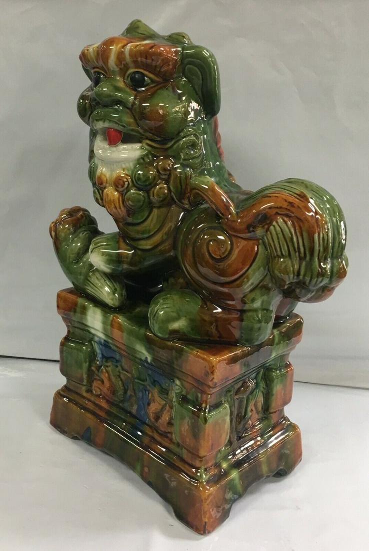 Vintage Asian Porcelain Foo Dog Guardian Lion Figurine 13": This beautiful foo dog figurine is in outstanding condition with no nicks, chips, crazing or any other flaws seen. The figure has an attractive, untouched, glazed finish. The base also shows no signs 