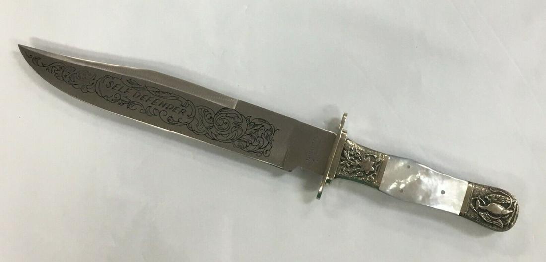 Vintage Parker Cut. Co. Japan Mother of Pearl "Self Defender" Bowie Knife #137: This beautiful knife is in very good condition with one light scratch on the blade as shown in the photo 8. The blade of this knife seems to have never been used or sharpened. It measures about 13 1/2