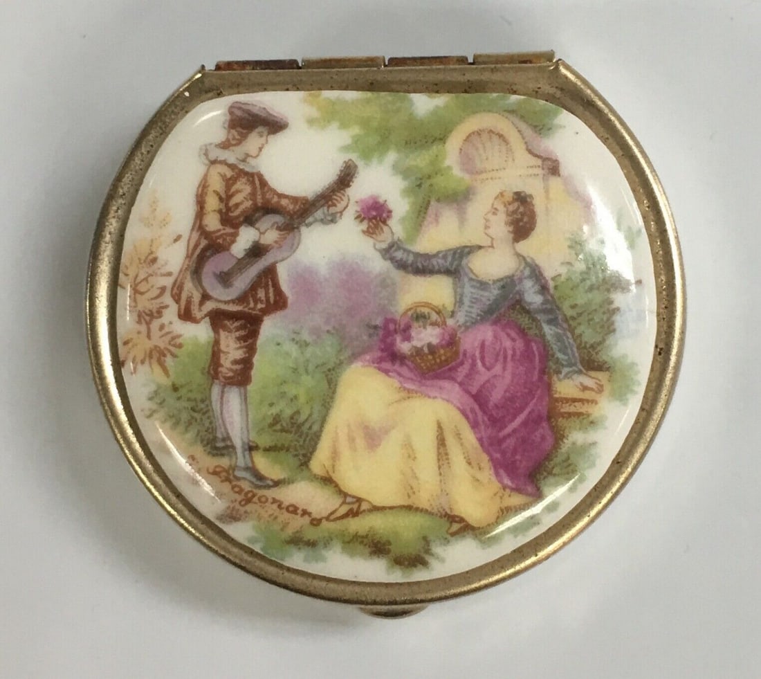 Vintage Limoges Style Fragonard Courting Couple Scene Pill Box: Vintage Limoges Style Fragonard Courting Couple Scene Pill Box. This box is in very good condition with signs of wear like few dark spots as shown in the photos. There is the plastic insert inside. It