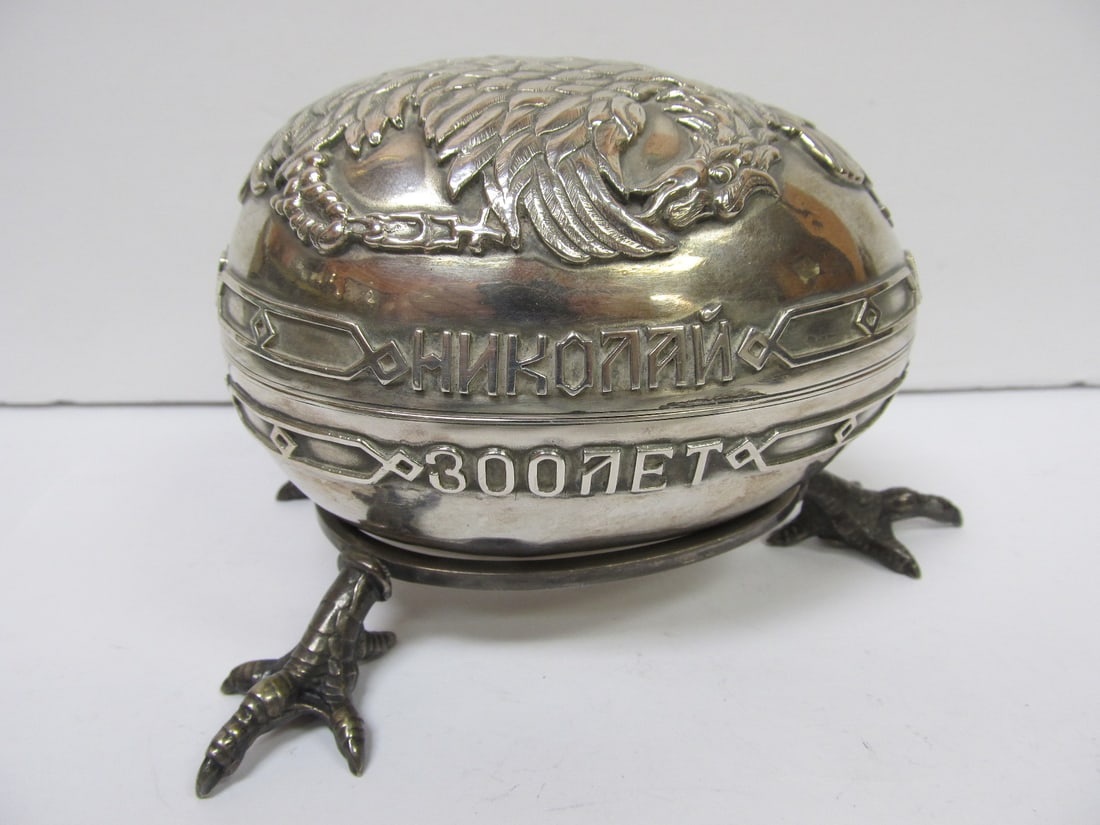RUSSIA RUSSIAN IMPERIAL EGG 84 SILVER 300 YEAR RULE 1613-1913 V GOOD COND: This fine Russian 2 part Imperial 84 silver egg on a stand commemorates 300 years from the earliest Romanov ruler Michail in 1613 to the last ruler Nikolai in 1913. The claw based holder with the thre