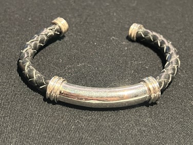 Sterling silver cuff bracelet with braided leather detail