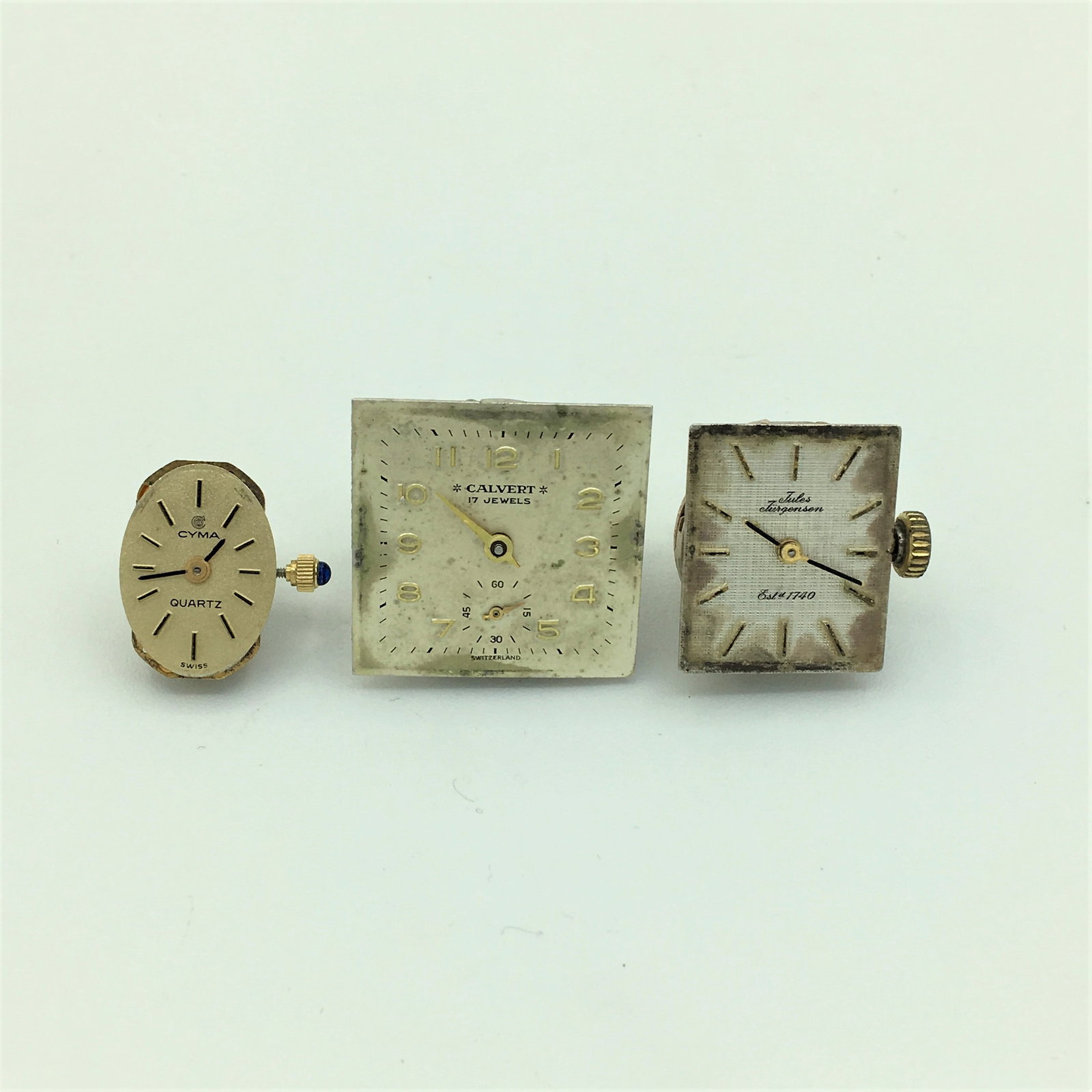 Lot of Three Wrist Watch Movements Cyma, Calvert & Jules Jurgensen: Lot of Three Wrist Watch Movements Cyma, Calvert & Jules Jurgensen. Cyma Quartz Swiss 5 Jewel Unadjusted Calvert Swiss 17 Jewel Unadjusted. Jules Jurgensen 17 Jewel RAX. Selling as is for Parts/Repair