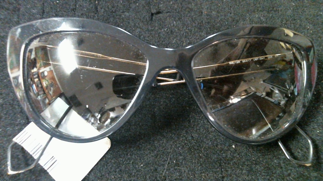 Miu Miu SMU 12R Cat Eye Eyeglasses Italy Black Acetate Gold Wire Temples Double: The Miu Miu Cat-Eye Sunglasses SMU 12R in black rims with gold colored stems & grey gradient lenses are a luxurious accessory designed for women. Made with lightweight plastic & metal frames, 
