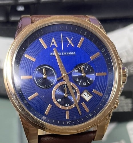Armani Exchange Men's AX2508 Brown Leather Watch: Elevate your style with this Armani Exchange men's wristwatch, model AX2508. Crafted with a gold-tone stainless steel case and a brown leather strap, this watch boasts a classic and timeless appeal. T