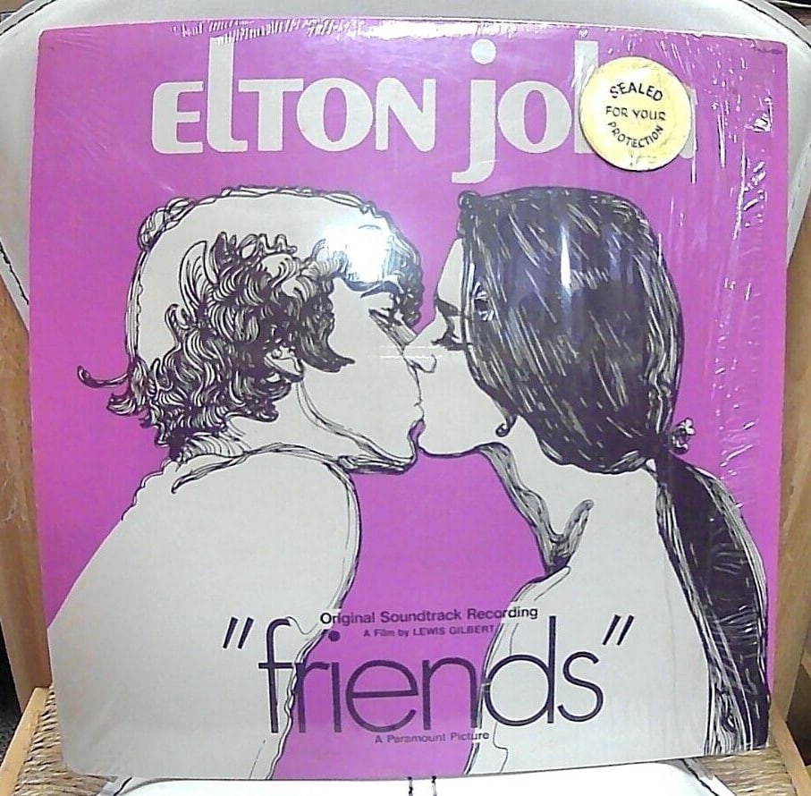 Elton John Friends Soundtrack Paramount 1970 Vinyl LPS-6004: This is a 12" LP featuring hits like "Can I Put You On" and "Friends," and showcases Elton John's signature piano playing. Produced by Gus Dudgeon, this LP captures the sound and style of the 1970s po