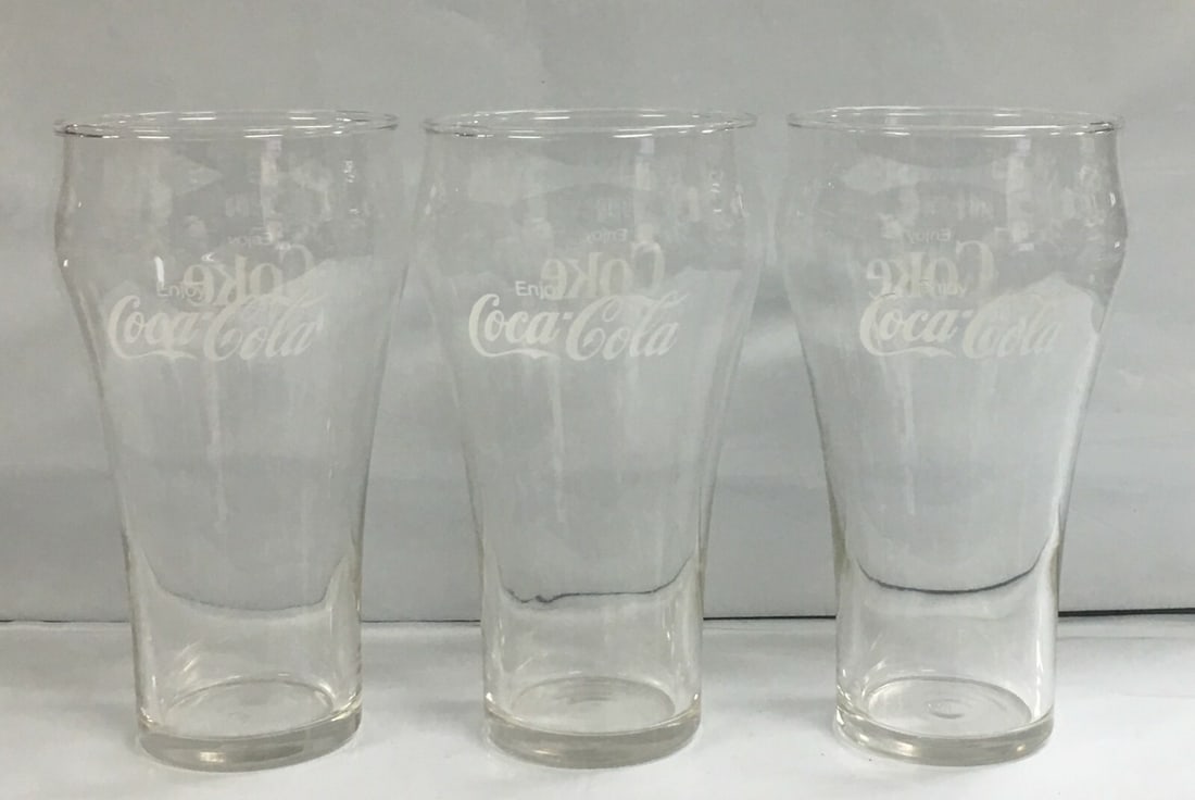 Set of 3 Vintage Enjoy Coca-Cola Coke Bell Shaped Drinking Glasses 6": These glasses are in outstanding condition with no nicks, chips, crazing or any other flaws seen. Please, review pictures for condition and details. This would be a great addition to your collection!