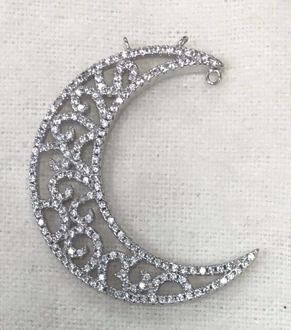 Beautiful Filigree Moon Pendant with CZ Stones 1 2/8" Long: This pendant is in excellent condition without any visible flaws. It is marked 925. This pendant is made in the form of a moon with sparkling stones which gives it a special appeal. It shines so much 
