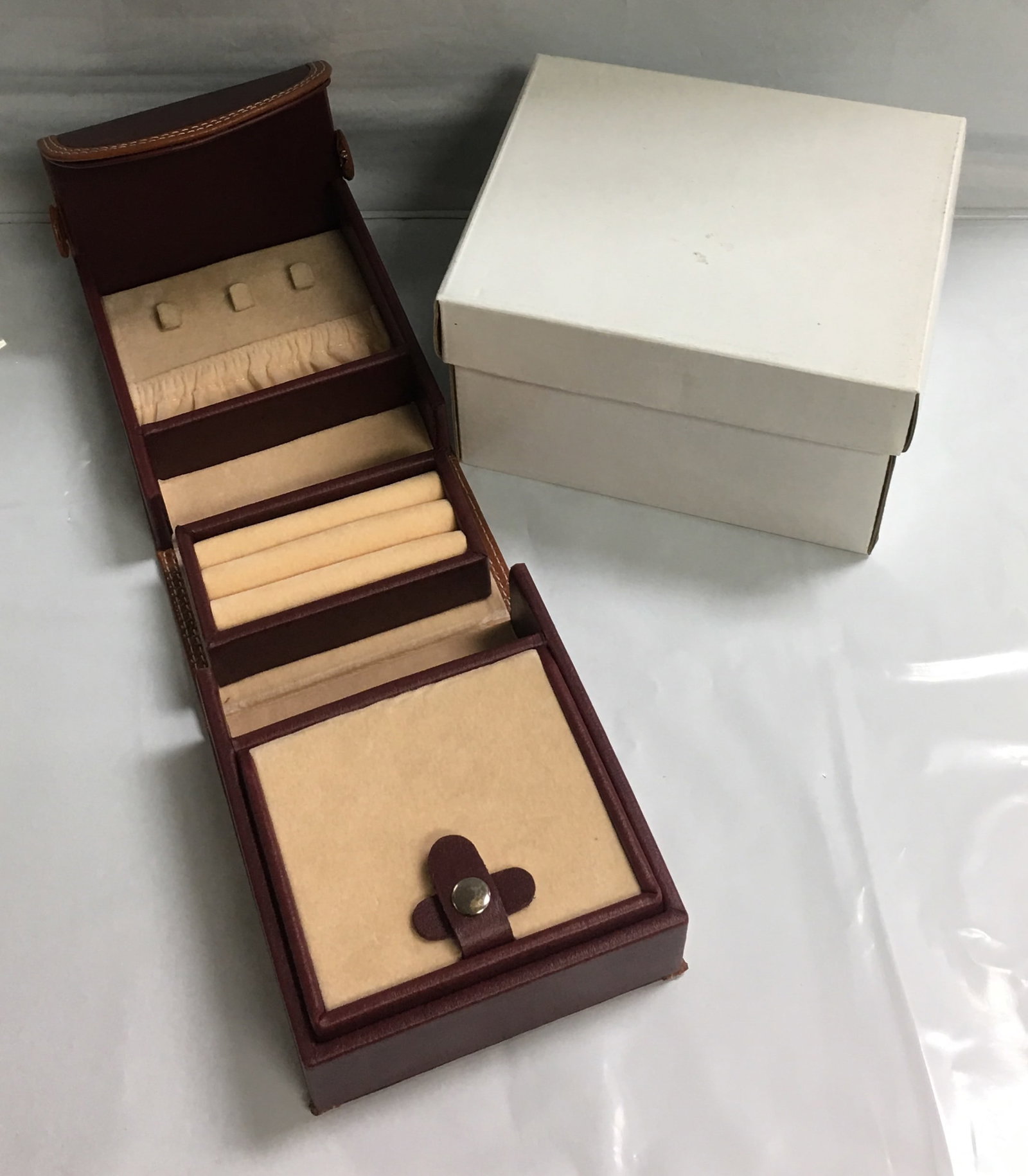 Leather Small Travel Size Folding Jewelry Box Case Organizer: This jewelry box is brand new. This folded box measures about 4" by 5" by 3". Please, review pictures for additional details.
