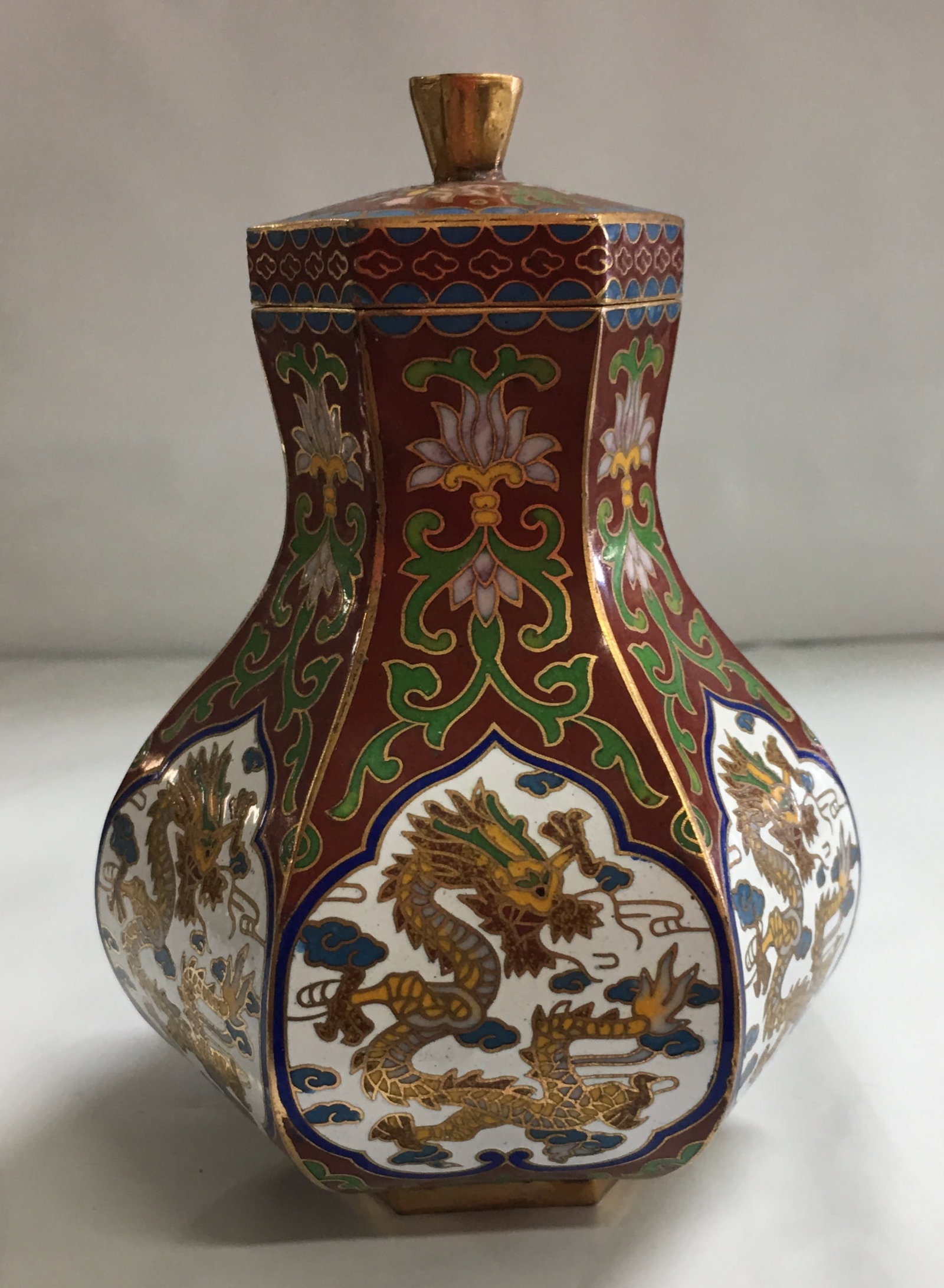 Vintage Chinese Enameled Six Sided Lidded Jar with Dragon Design 4.5": This beautiful jar is in overall excellent condition with little signs of wear seen. It is about 4 1/2" tall with lid, about 1 1/2" in diameter at the top, and about 3" wide at the widest point. Pleas
