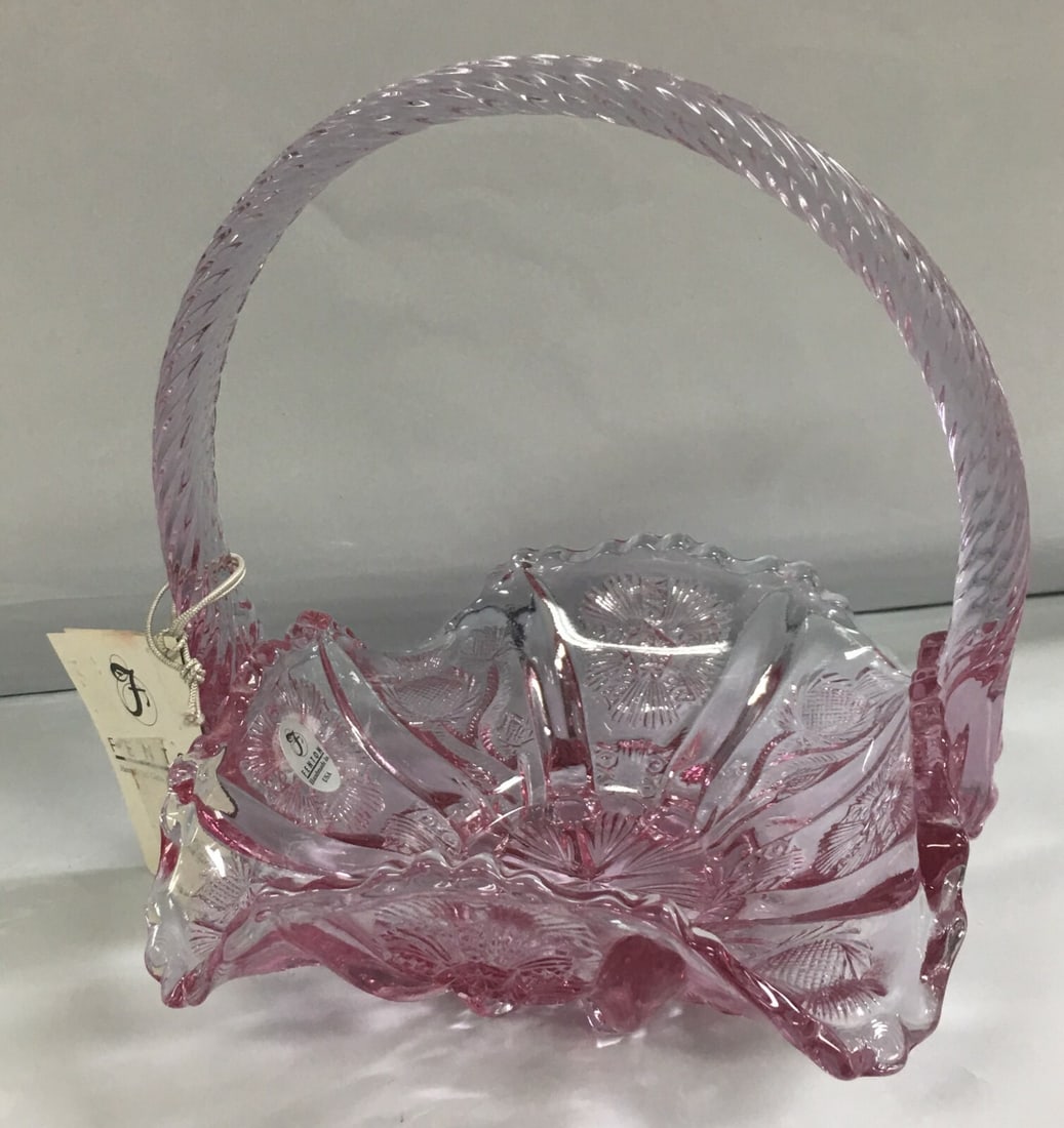 Vintage Fenton Handcrafted Glass Pink Basket with Twisted Handle: This basket is in excellent, like new condition with label and tag. There are no chips, no scratches or any damages seen. It measures about 6 2/8" wide by 5 6/8" across by 2 5/8" high. Together with h