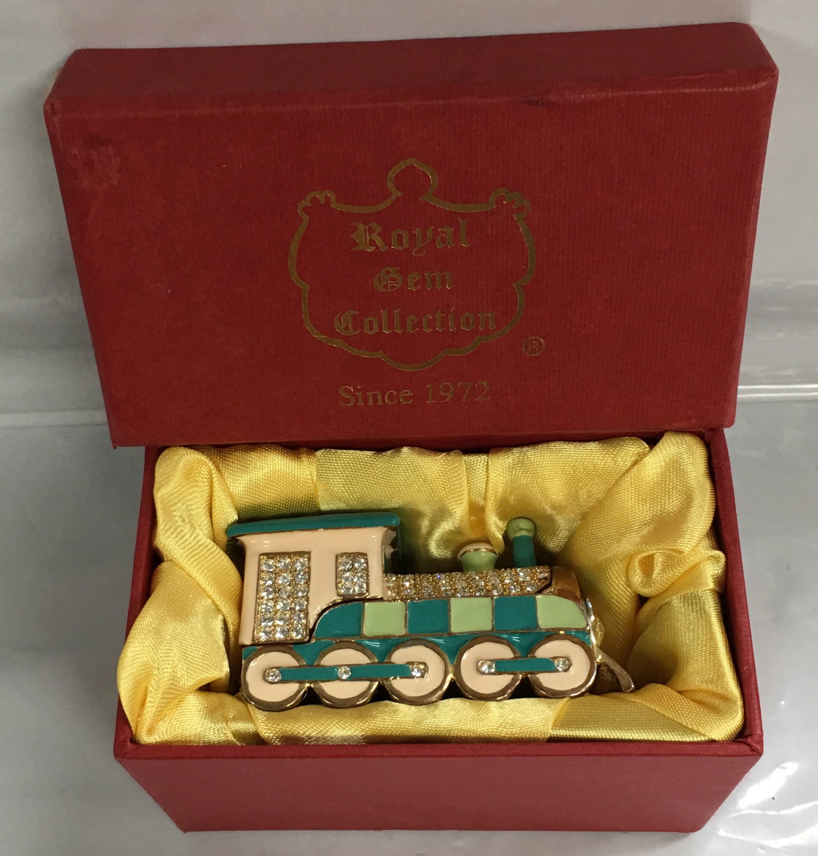 Royal Gem Collection Enameled with Rhinestones Jewelry Trinket Box: This beautiful box is in excellent condition with a little signs of wear seen. It comes in original box. It measures about 2 5/8" by 1 1/2" by 1 3/4". Please, review pictures for condition and details