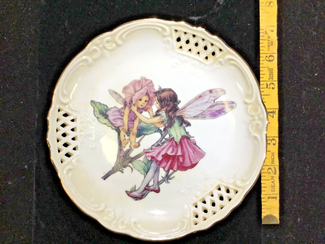 VINTAGE PRINCESS PLATE by FLOWER FAIRIES COLLECTION '98Reutter Porzellan Germany: This is a vintage collector plate from the Flower Fairies Collection '98 by Reutter Porzellan, made in Germany. The plate is round, with a diameter of 7 inches, and features a princess fairy in a mult