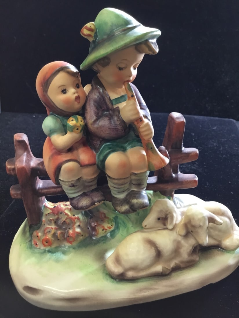 VINTAGE HUMMEL GOEBEL FIGURINE "EVENTIDE" #99 BOY & GIRL W/ THEIR SHEEP GERMANY: This vintage Hummel Goebel figurine, titled "Eventide," depicts a charming scene of a boy and girl with their sheep. Made in Germany during the late 20th century, this original piece is crafted from p