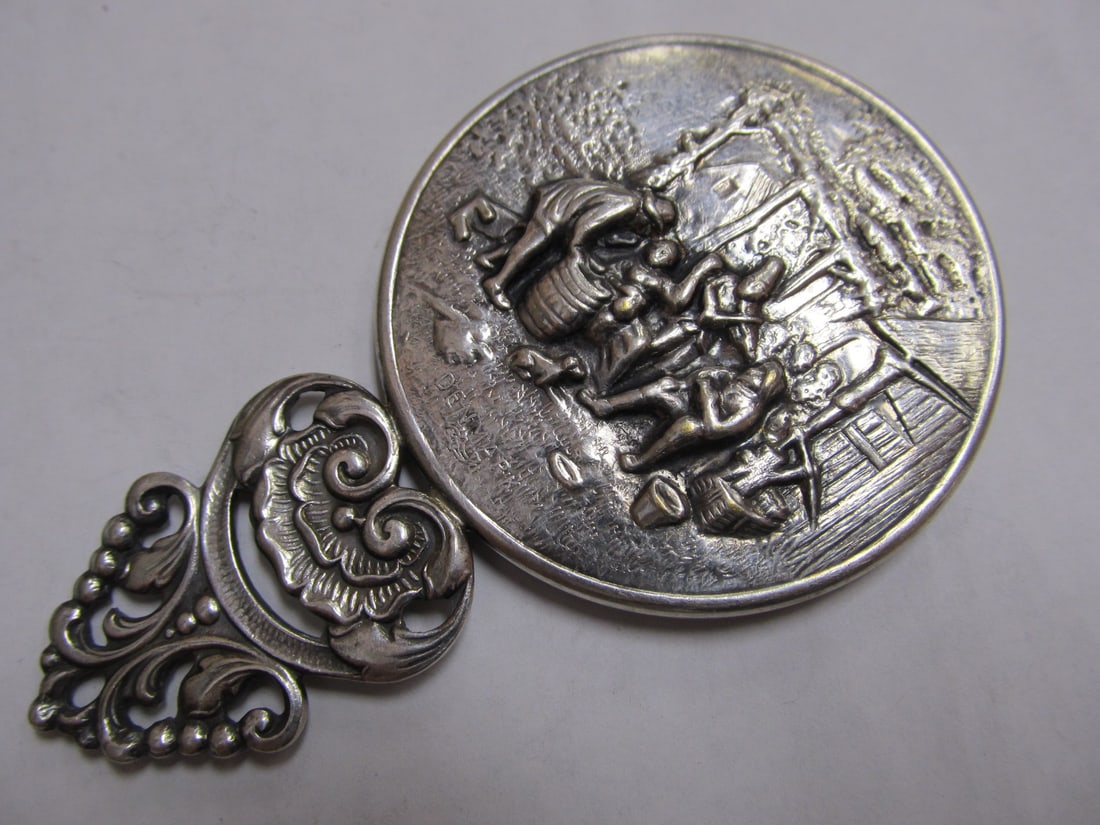 DENMARK SILVER HANS JENSEN HAND MIRROR VILLAGE SCENE 4 3/8" H GOOD COND: This nice stamped Denmark small silver plated hand mirror features a nice, raised village scene. The glass mirror shows slight wear at the edge; otherwise the hand mirror is in very good condition.