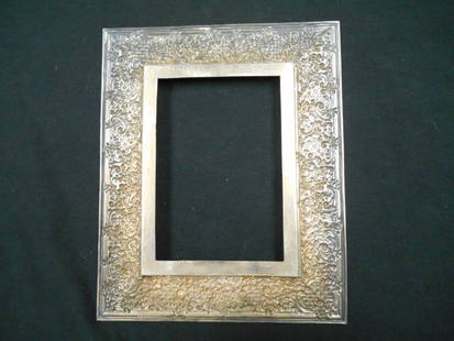 Tiffany & Co. Picture Frame: Sterling silver 4x6 frame with floral pattern on edges. Weighs 7.67 oz