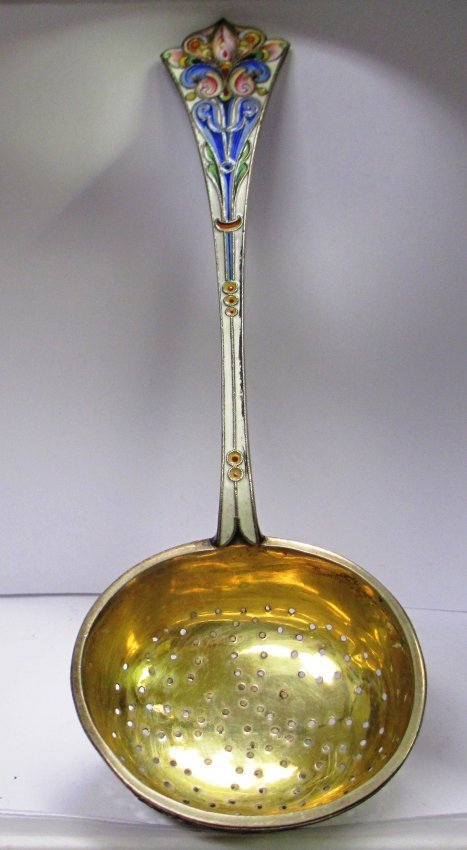 RUSSIAN SILVER ENAMEL TEA STRAINER: Russian silver and enamel tea strainer. Holds Imperial Warrant 84 Silver Purity Mark, and Town Hallmark. Measures 6 1/2" length. Weighs 2.115 ozt.