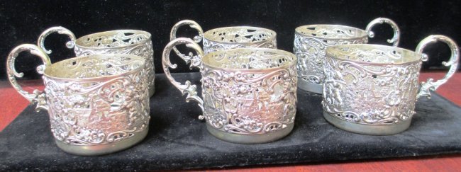 SIX RUSSIAN SILVER REPOUSSE CUPS: Stamped 800 on Bottom Detailed engraved Town Hall Scene Each cup measures 2 1/2" Tall x 2 1/2" Diameter. Each Cup weights 3.08 ozt