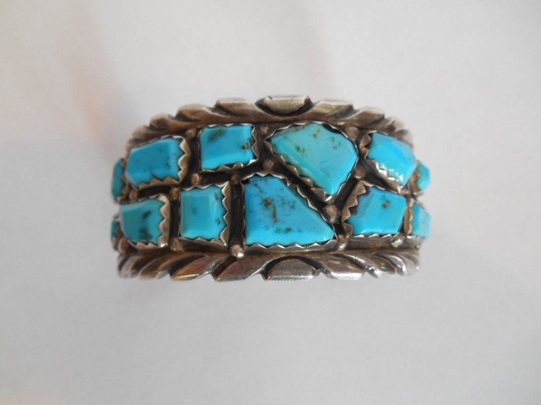 VINTAGE NAVAJO SILVER AND TURQUOISE CUFF SIGNED WAYNE: Signed Vintage Navajo Silver and Turquoise Cuff. Signed Wayne C. Weight: 58 Grams. 14Pieces of Turquoise. Opening 1 1/8”
