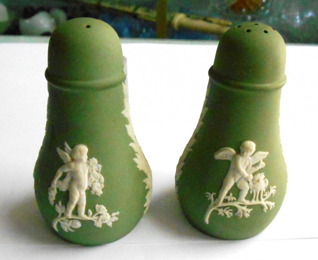 PAIR WEDGWOOD GREEN JASPER SALT/ PEPPER W/PUTTI THEME: Pair Wedgwood green jasperware salt / pepper with putti. 3 1/2” H X 2 1/8” W base.